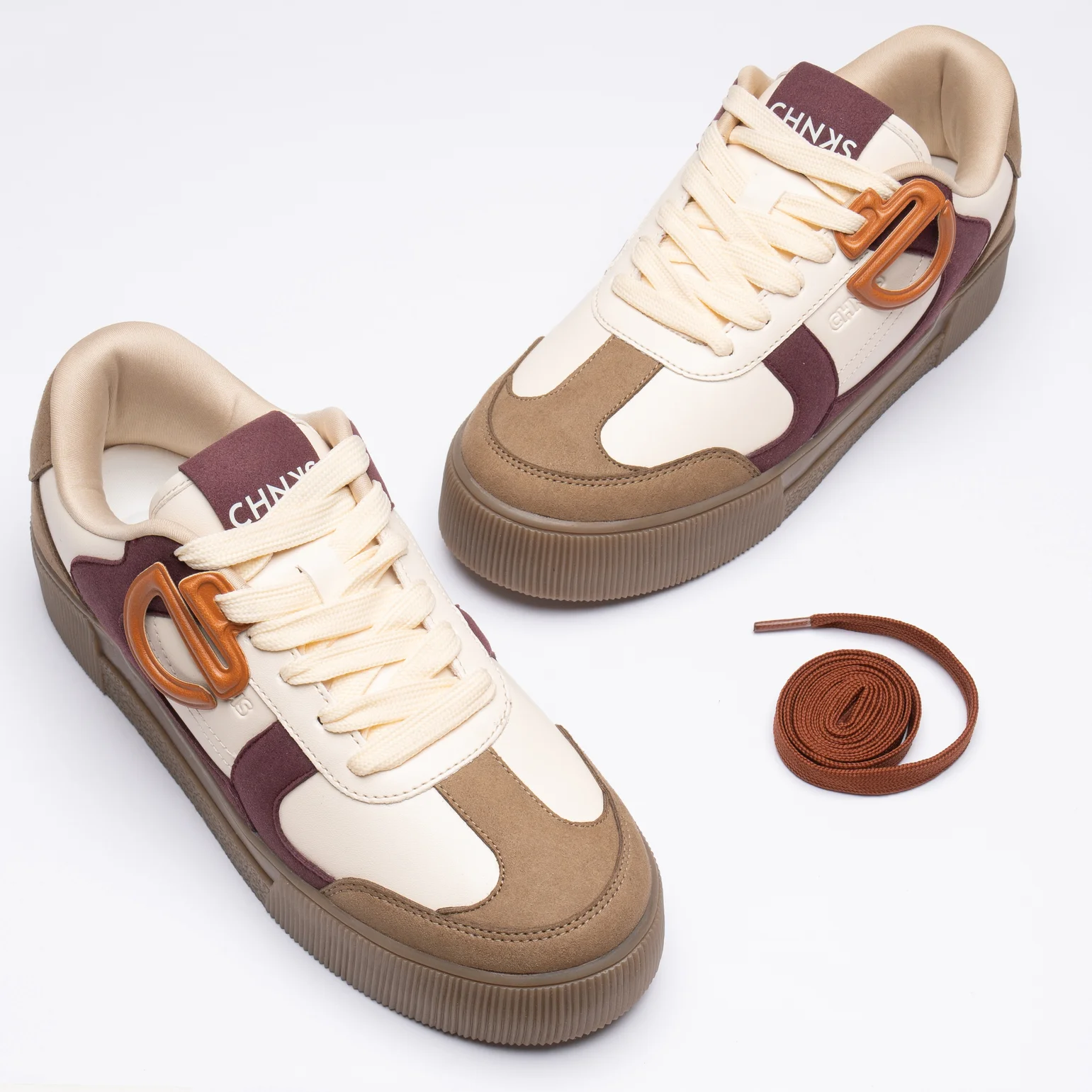 Front view of CHNKS Cranberry sneakers - maroon red sneakers for men and women featuring sleek toe design and lace-up closure