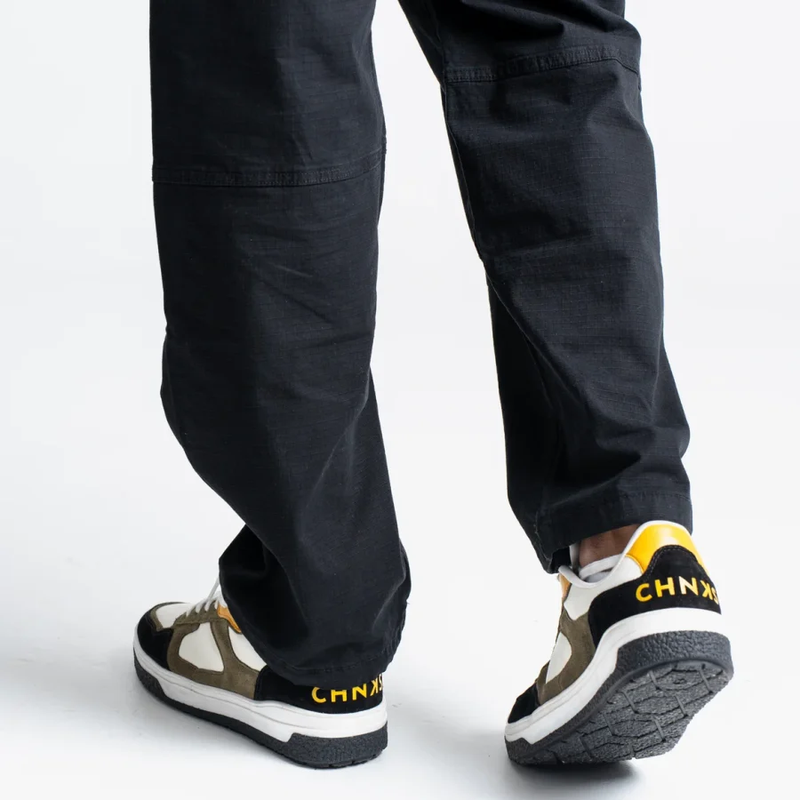 Taxi CHNKS sneakers on leg – men’s yellow and green sneakers for casual and streetwear fashion