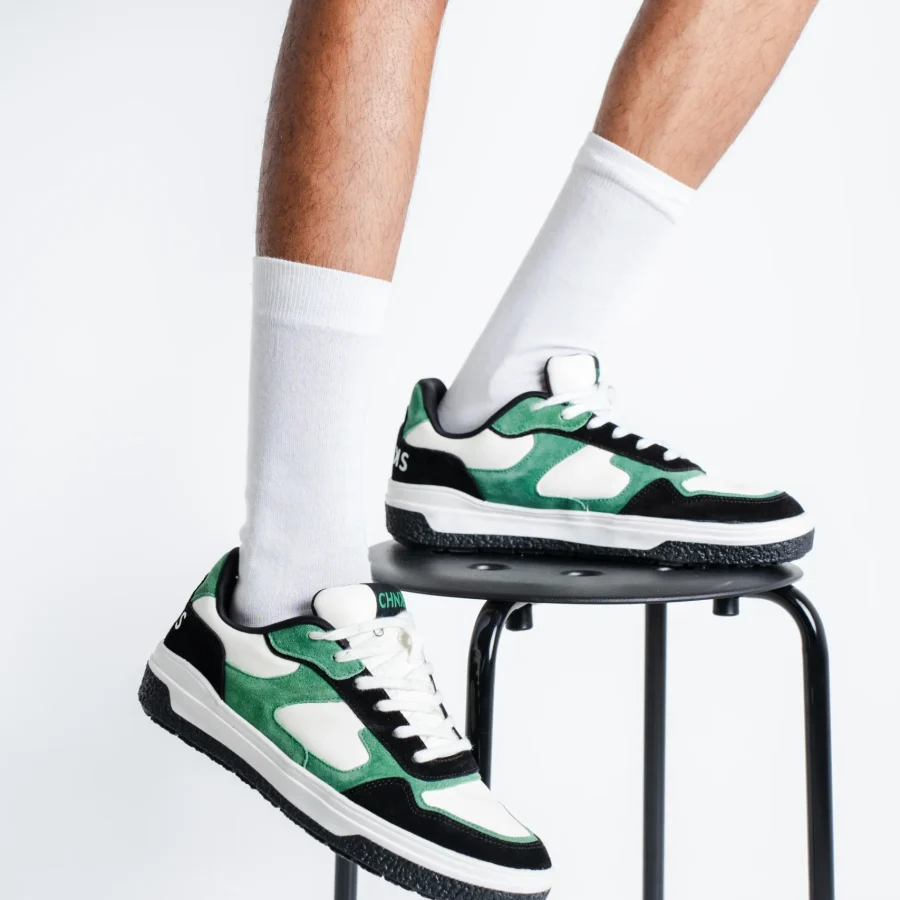 Matrix CHNKS sneakers on leg – men’s green sneakers for everyday street style