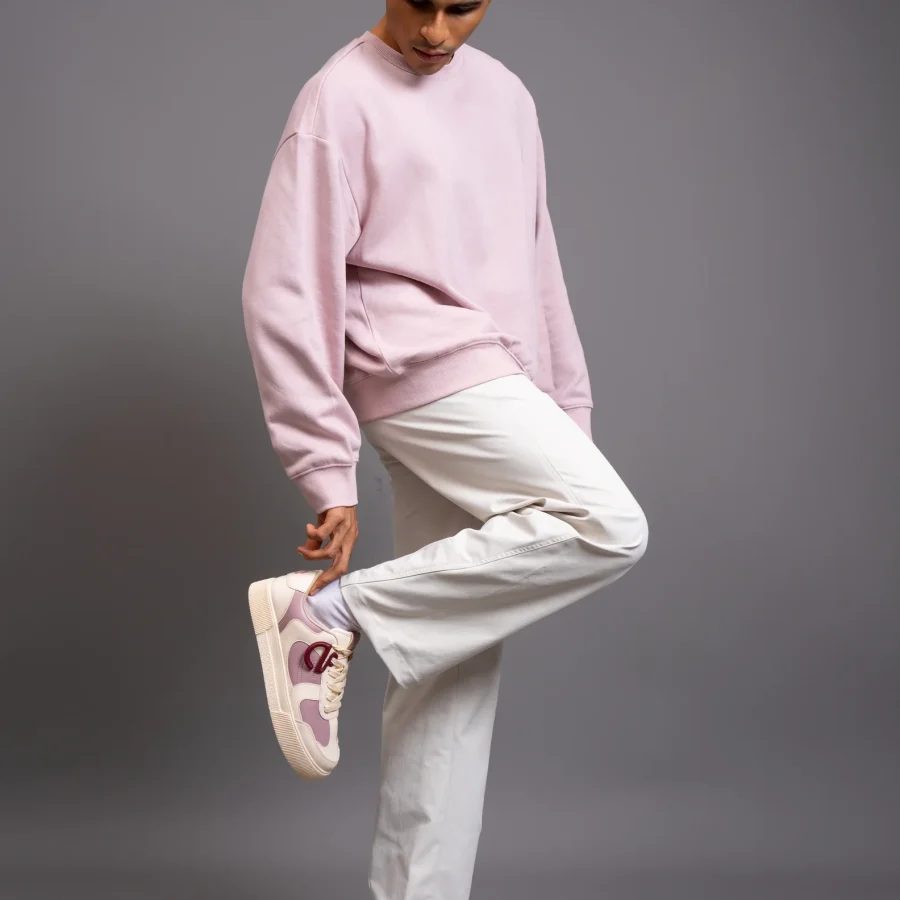 Man wearing Bubblegum CHNKS pink and white sneakers with pink hoodie and white trousers – casual sneakers for men