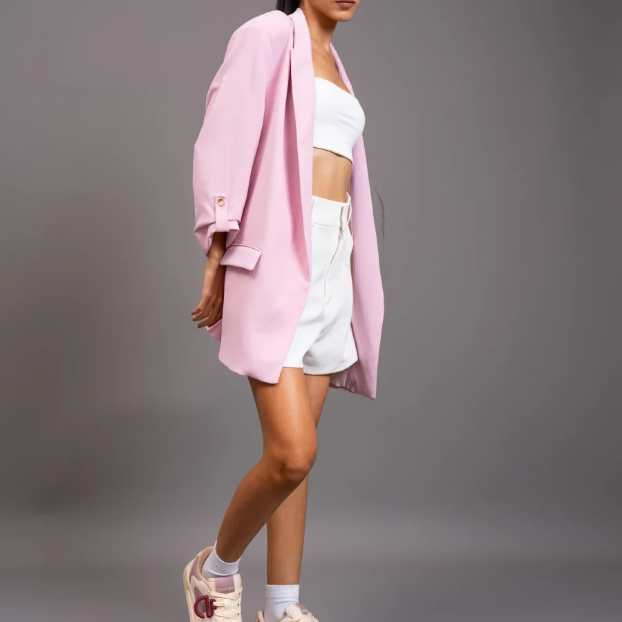 Woman wearing Bubblegum CHNKS pink and white sneakers with matching outfit – stylish casual wear