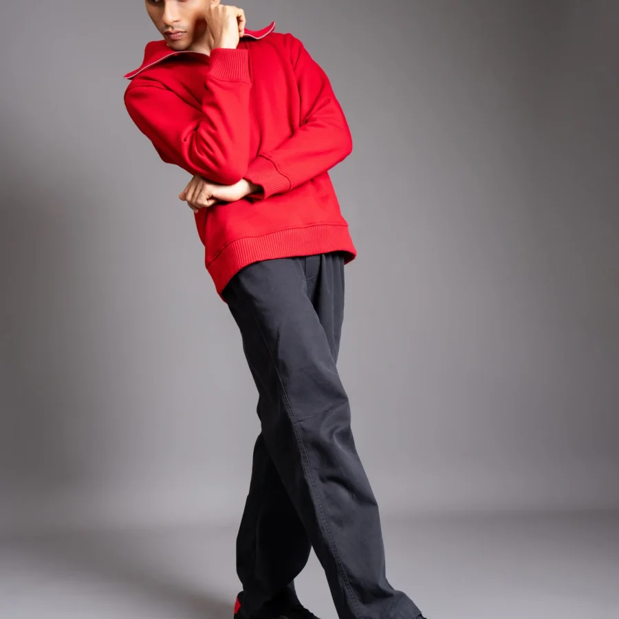 Model wearing Vinyl CHNKS sneakers with red t-shirt and black trouser – men’s streetwear look