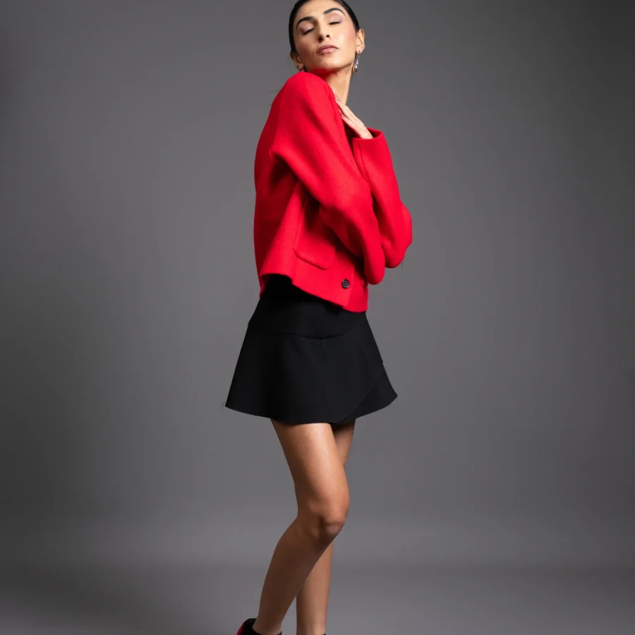 Model wearing Vinyl CHNKS sneakers with red and black outfit – women’s fashion look